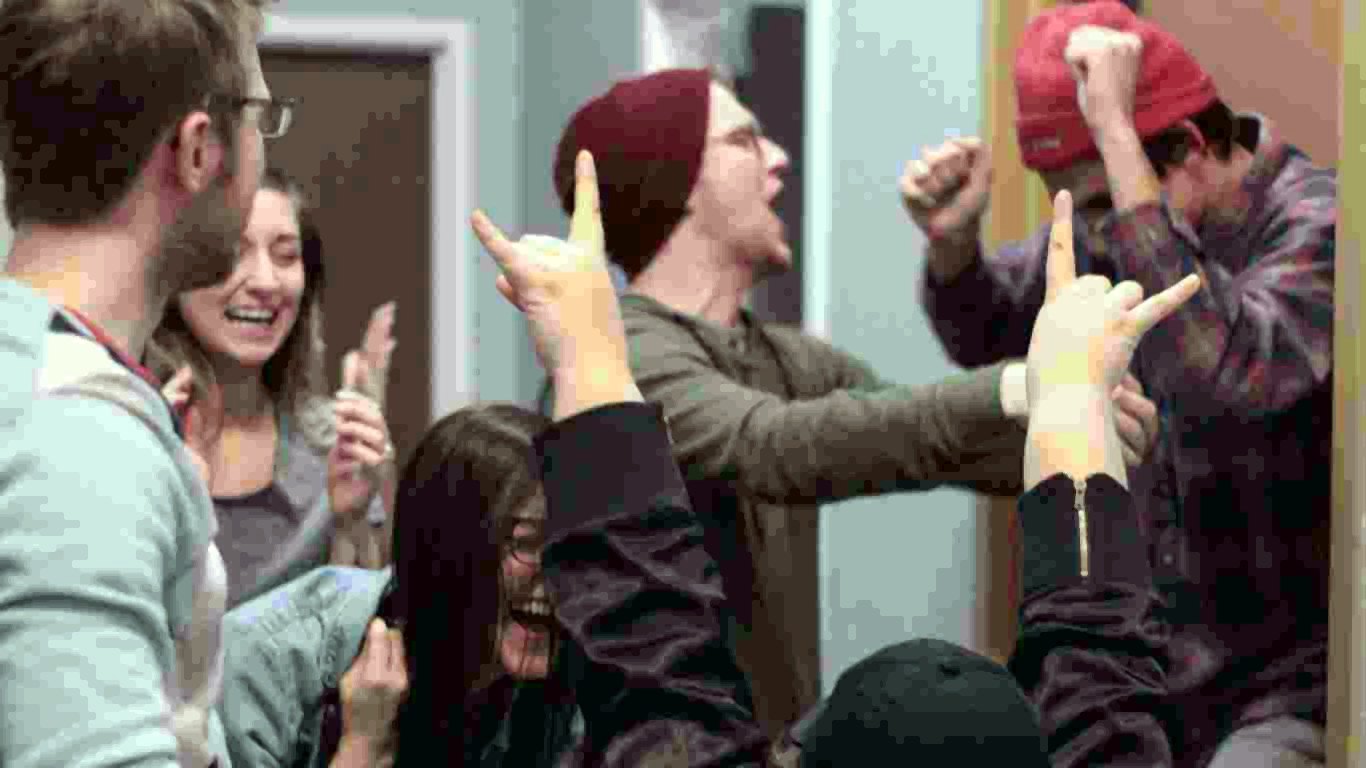 Players cheering after escaping a room at Breakout Lawrence